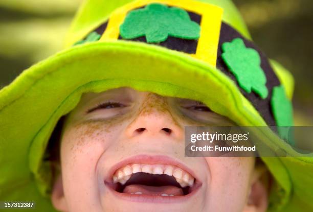 irish child st. patrick's day smiling leprechaun clover hat boy - st patricks day stock pictures, royalty-free photos & images