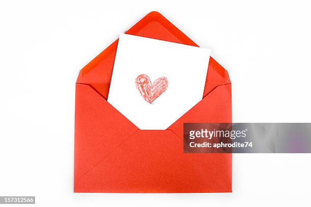 red heart drawn on white card within red envelope - love letter stock pictures, royalty-free photos & images