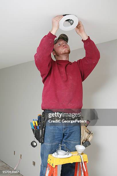 installing light fixture - installing ceiling light fixture stock pictures, royalty-free photos & images