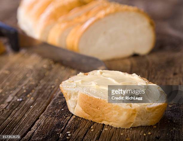bread on wood - bread and butter stock pictures, royalty-free photos & images