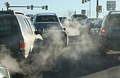 Polluting clouds of exhaust fumes rise in the air Denver Colorado