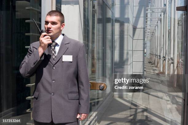 security guard - office building entrance people stock pictures, royalty-free photos & images