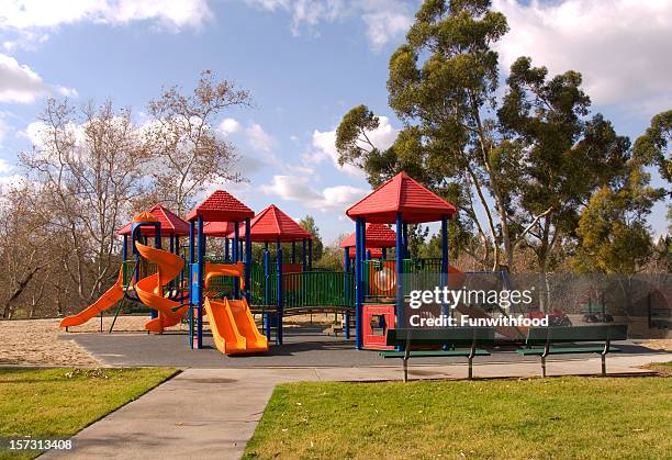 empty schoolyard playground, outdoor play equipment, nobody at park - outdoor play equipment stock pictures, royalty-free photos & images