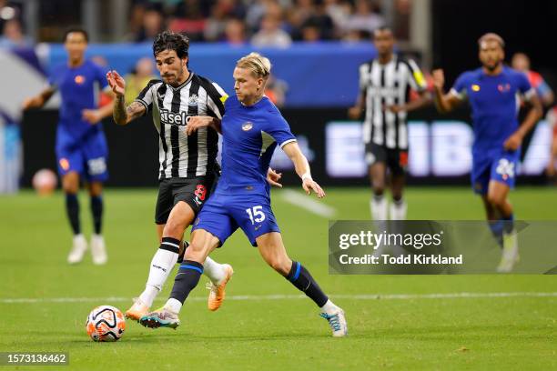 Mykhailo Mudryk of Chelsea is challenged by Sandro Tonali of Newcastle United during the Premier League Summer Series match between Chelsea FC and...