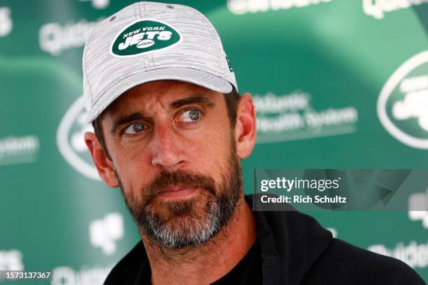 Quarterback Aaron Rodgers of the New York Jets talks to reporters after training camp at Atlantic Health Jets Training Center on July 26, 2023 in...