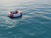 Life buoy floating on a rippled sea