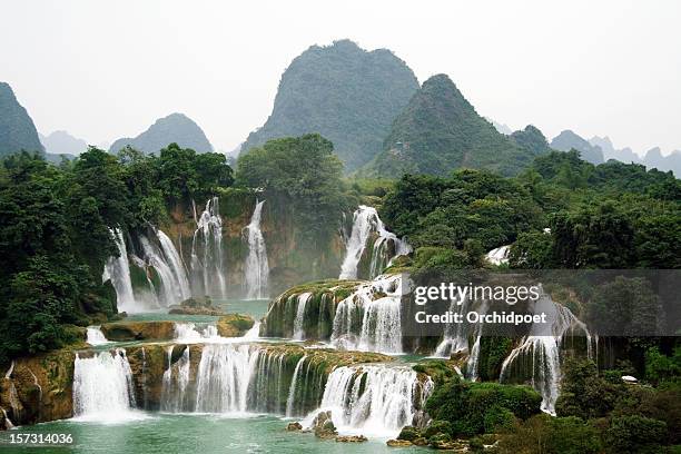 spectacular waterfalls in mountains - detian waterfall stock pictures, royalty-free photos & images
