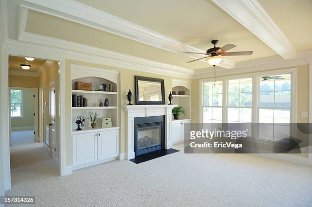 living room with fireplace - carpets stock pictures, royalty-free photos & images