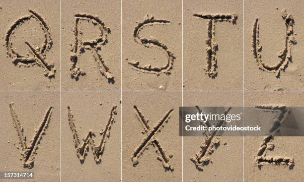 sand alphabet xxxl - letter v stockfoto's en -beelden