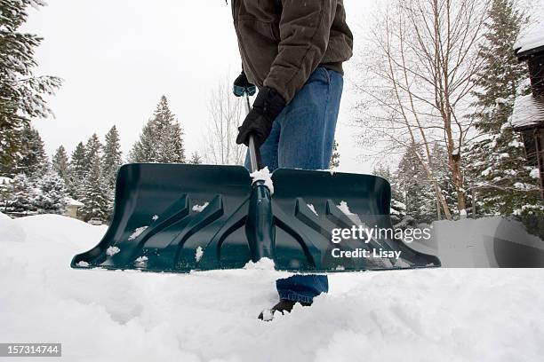 shovel - snow shovel man stock pictures, royalty-free photos & images