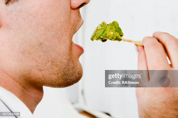 eating guacamole and chips - nachos stock pictures, royalty-free photos & images