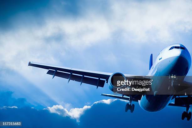 airliner landing in a storm - facing things head on stock pictures, royalty-free photos & images