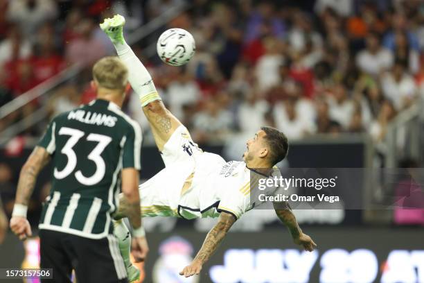 Joselu of Real Madrid kicks the ball during a friendly match between Real Madrid and Manchester United as part Soccer Champion Tour at NRG Stadium on...