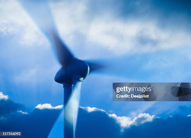 wind turbine stormy sky - propeller stock pictures, royalty-free photos & images