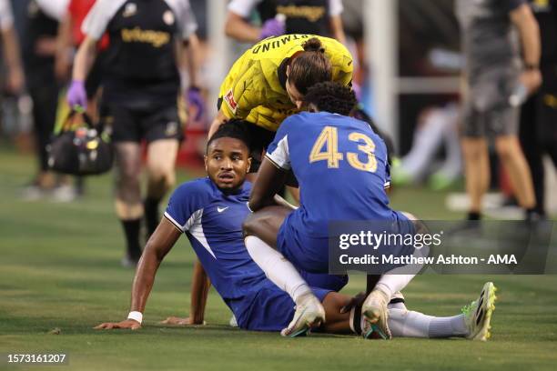 Christopher Nkunku of Chelsea goes down with an injury in the first half resulting in him leaving the game during the pre-season friendly match...