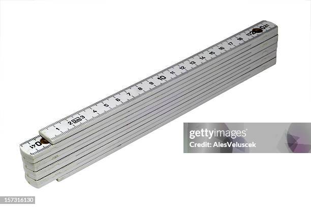 a silver folding ruler on a white background - ruler stock pictures, royalty-free photos & images