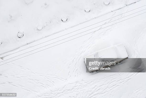 snow-covered street - covered car street stock pictures, royalty-free photos & images