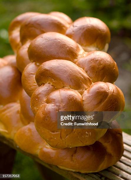 challah bread loaf, baking homemade braided brioche loaves background - braided bread stock pictures, royalty-free photos & images