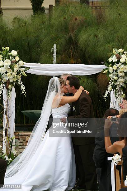 you may kiss the bride - wedding ceremony kiss stock pictures, royalty-free photos & images