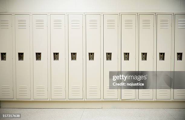 row of tall white lockers in a white corridor - lockers bildbanksfoton och bilder