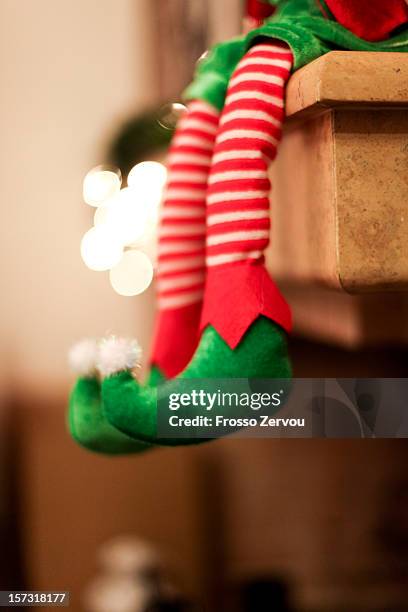 a sitting elf - christmas elf stock pictures, royalty-free photos & images