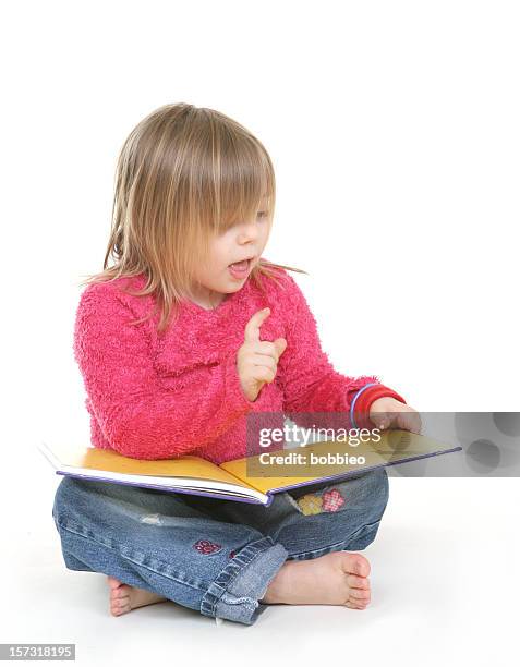 a little blonde girl learning to read - kid sitting stock pictures, royalty-free photos & images