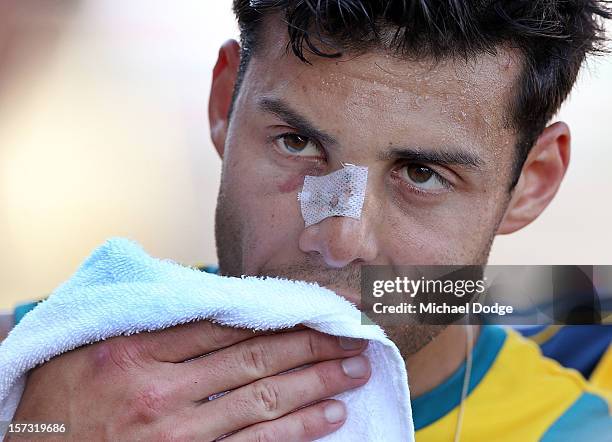 Chris Ciriello of Australia rests after the match between Australia and the Netherlands during day two of the Champions Trophy on December 2, 2012 in...