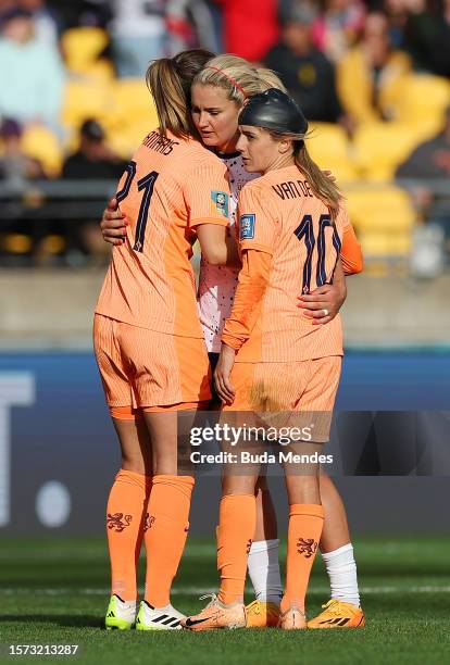 Lindsey Horan of USA embraces Damaris Egurrola and Danielle Van De Donk of Netherlands after the 1-1 draw in the FIFA Women's World Cup Australia &...