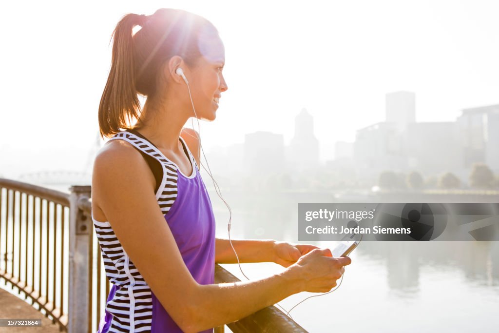 A woman listening to music.