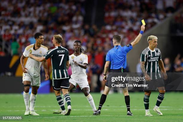 Mason Mount of Manchester United and Jude Bellingham of Real Madrid react in the first half during the 2023 Soccer Champions Tour match at NRG...