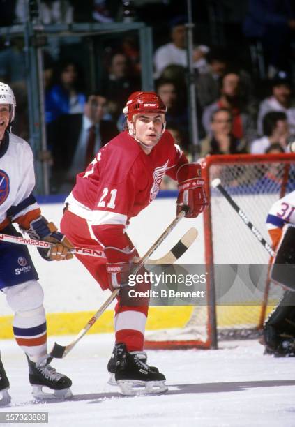Adam Oates of the Detroit Red Wings skates on the ice during an NHL game against the New York Islanders circa 1988 at the Nassau Coliseum in...