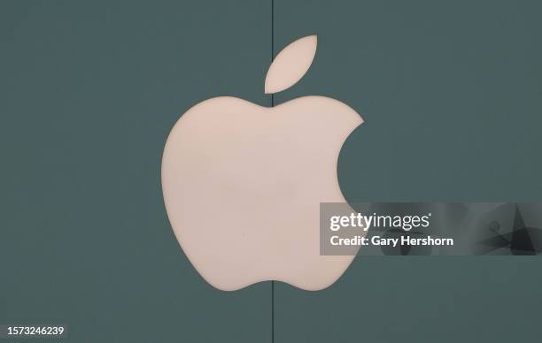 An Apple corporate logo hangs on a wall outside their store at the Eaton Center shopping mall on July 26 in Toronto, Canada.