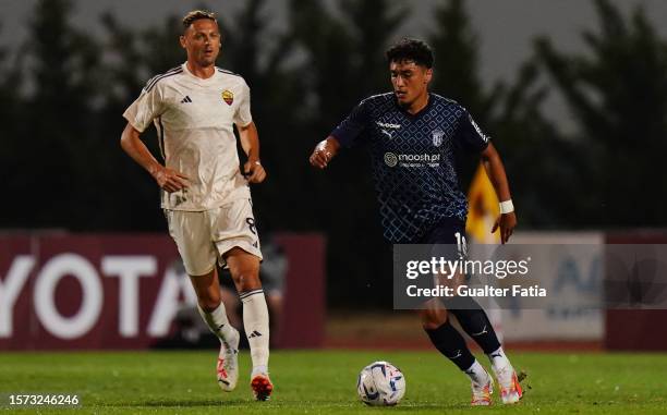 Vitor Carvalho of SC Braga with Nemanja Matic of AS Roma in action during the Pre-Season Friendly match between AS Roma and SC Braga at Estadio...