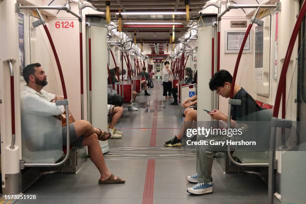 People ride on a subway train at the Finch Station on July 26 in Toronto, Canada.