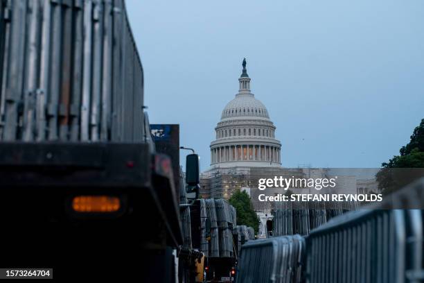 Workers set up security barricades outside the US Capitol in Washington, DC, on August 2 ahead of the arraignment of former US President Donald...