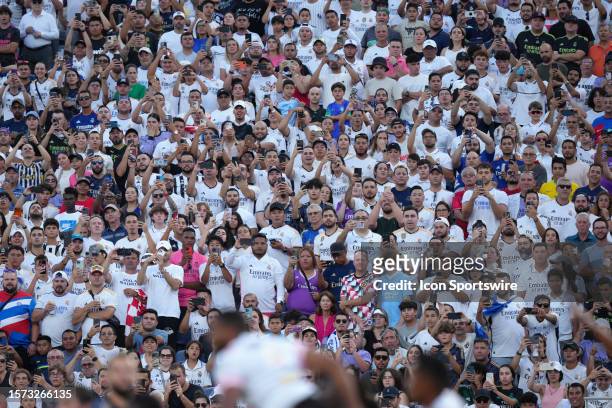 Fans take phone photos and video during the Soccer Champions Tour match between Juventus and Real Madrid on Wednesday, August 2 at Camping World...