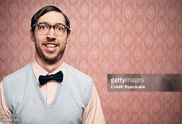 nerd student with retro glasses and pink wallpaper - ugly people stock pictures, royalty-free photos & images