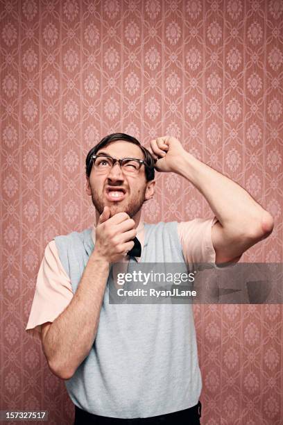 confused nerd student trying to solve a problem - scratching head stock pictures, royalty-free photos & images