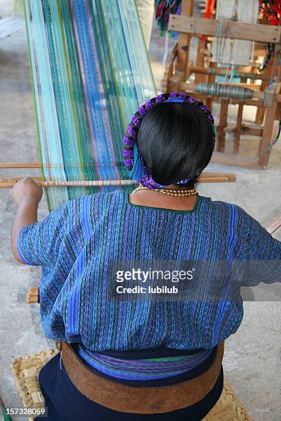 mayan woman weaving in village by lake atitlan, guatemala - maya guatemala stock pictures, royalty-free photos & images