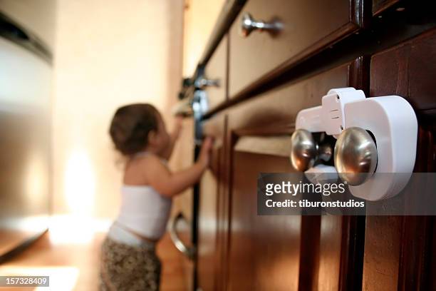 child proofing cabinet locks - child proof stock pictures, royalty-free photos & images
