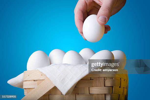 all your eggs in one basket - eggs basket stock pictures, royalty-free photos & images