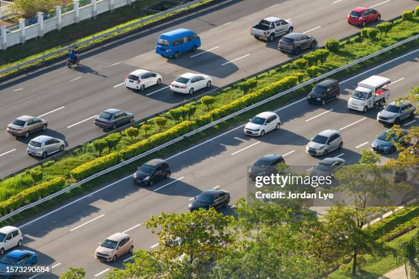 aerial view of city traffic on a highway - highway patrol stock-fotos und bilder