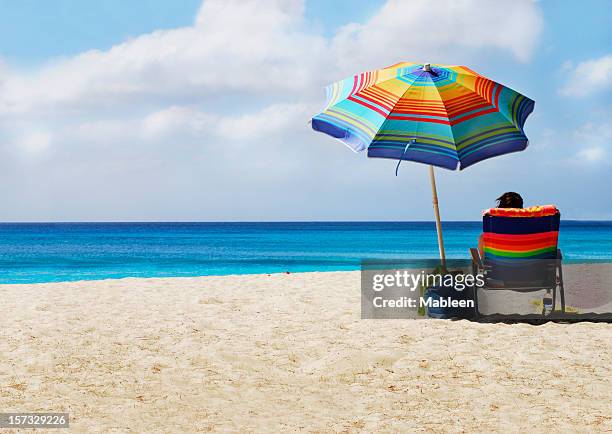 heaven on earth! - beach umbrella isolated stockfoto's en -beelden