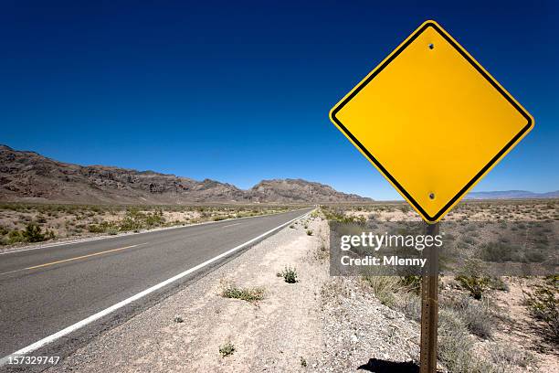 blank sign desert highway - blank road signs stockfoto's en -beelden