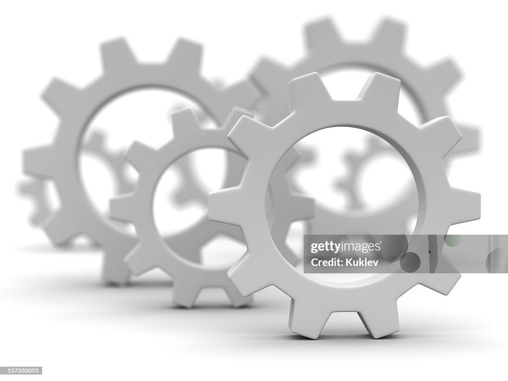 Close-up of gray gearwheels on white background