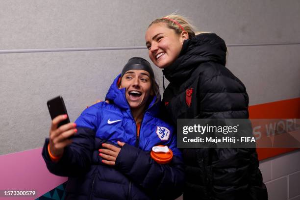 Danielle Van De Donk of Netherlands and Lindsey Horan of USA take a photograph in the tunnel after the FIFA Women's World Cup Australia & New Zealand...