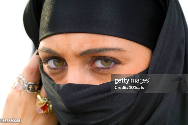 muslim woman - muslim woman darkness stock pictures, royalty-free photos & images