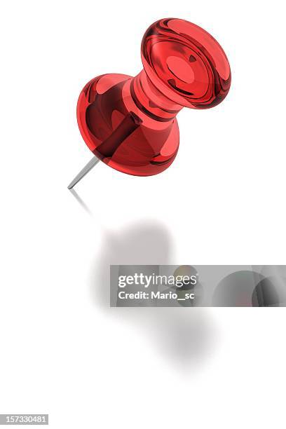 a red pin on white background  - pins stockfoto's en -beelden