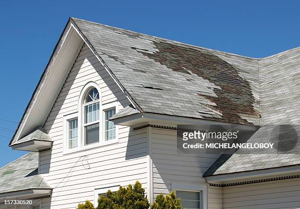homeowner roof repair - damaged stock pictures, royalty-free photos & images