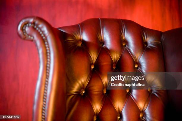 classic chair in red background - red office chair stock pictures, royalty-free photos & images